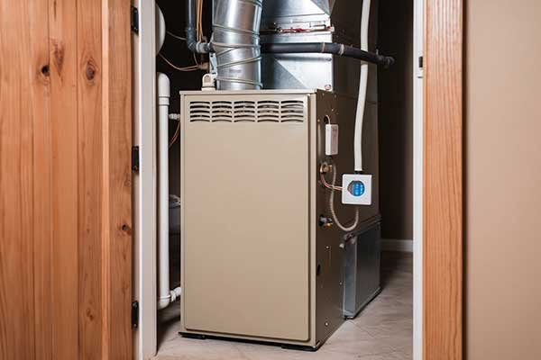 Malfunctioning furnace in a Las Cruces home, showing visible components needing repair