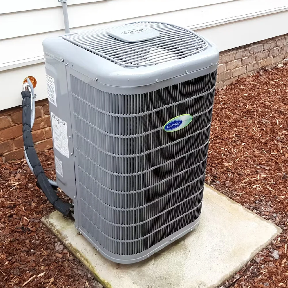 Carrier air conditioning unit professionally installed outside a home in Anthony, NM, ensuring efficient cooling and comfort.